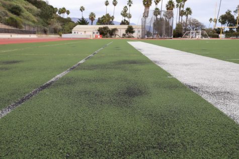 The black gravel that is laid down before artificial turf is installed now shows through in all areas of the La Playa Field at City College in Santa Barbara, Calif. The 11-year-old artificial turf that has an eight year life span is three years overdue on a replacement. 