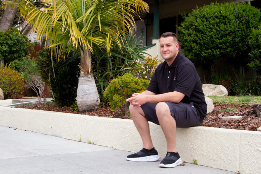 Program Manager Grant Dillon sits in front of the New House sober living home on March 14, 2021, at 227 W. Haley St. in Santa Barbara, Calif. Dillion is in recovery after a car accident led to an addiction to painkillers; and now three years sober, he is pursuing a counseling certificate by attending classes in City Colleges Addictive Disorders Counseling program.