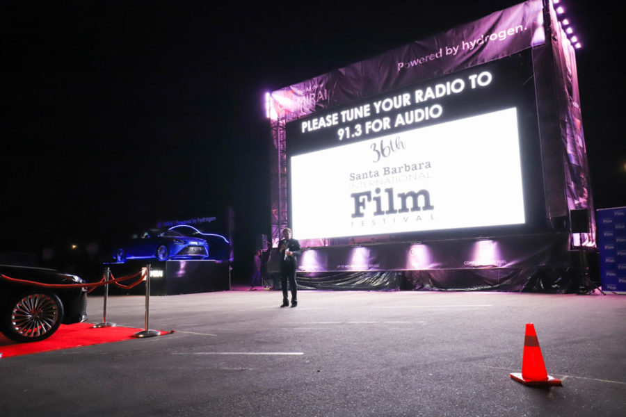 Executive Director Roger Durling kicked off the the festival with warm welcomes and many thank yous for each sponsor before introducing the opening film Invisible Valley and handing over the mic to film director Aaron Mauer on March 31, 2021, at the temporary drive-in movie theater in the parking lots of City College in Santa Barbara, Calif. “Even if we’re in cars, socially distanced and safe, at least we’re together and that’s what tonight is all about,” said Durling.