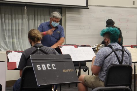 Jim Mooy conducts the brass section of the Lunch Break Big Band through a new song on Thursday, Aug. 26, 2021, in Room 105 in the Drama/Music building at City College in Santa Barbara, Calif. "Stop reading the charts," Mooy said to the band after they played through the song, "listen and vibe."