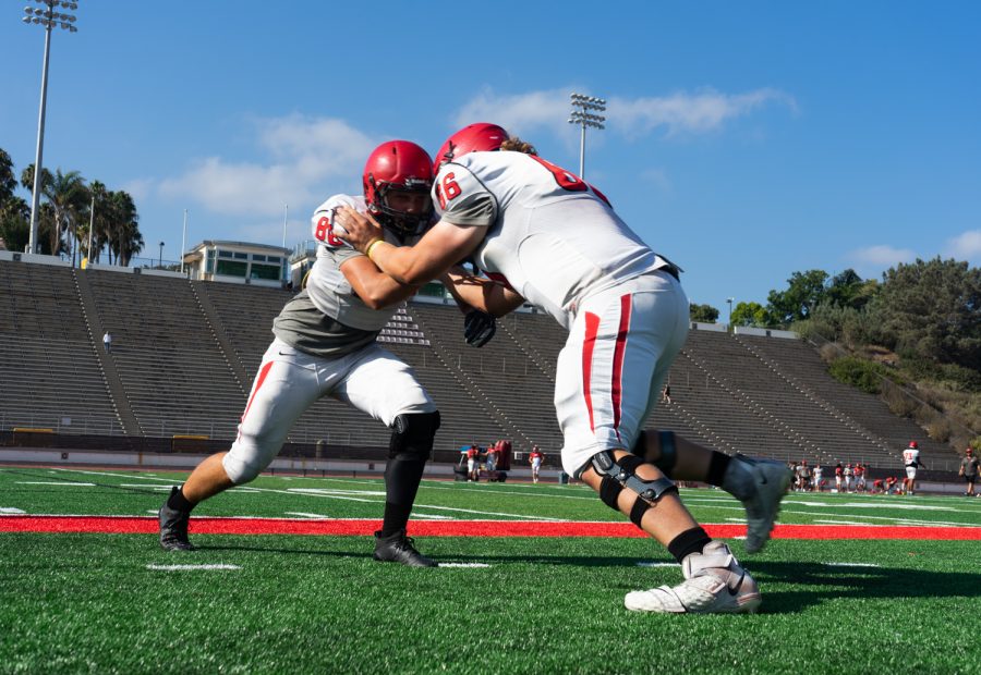 From left, Jaden Self and Howard Wood clash during defensive practice on Sept. 1 at La Playa Stadium at City College in Santa Barbara, Calif. This is their first year at City College.