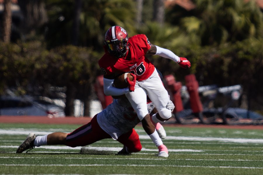 Running Back Jerry Martin dodges an LA Pierce College tackler on Saturday, Oct. 16 at City Colleges La Playa stadium in Santa Barbara, Calif. City College beat LA Pierce 60-6.