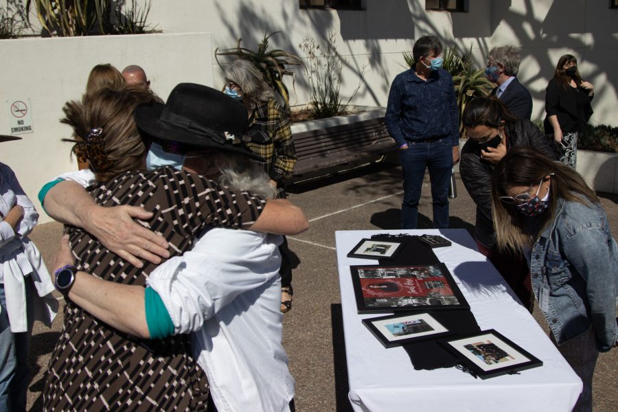 Retired DSPS Learning Disability Specialist Lesley Taylor embraces assistant DSPS tech service provider Lyn Paulos during a flag lowering ceremony to honor deceased DSPS faculty member Janet Hose’s life and services to City College on Monday, Oct. 18 outside of The Luria Library in Santa Barbara, Calif. “She was my dear friend,” Taylor said about Hose. 