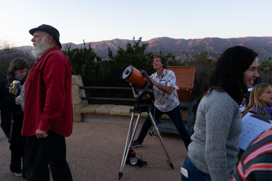 Astronomy instructor Sean Kelly gazes at the sky as he aligns a telescope towards the moon during an astronomy club ‘pizza party’ on Oct. 9 at the Winslow Maxwell overlook at City College in Santa Barbara, Calif. The clubs events are not only just for students, but are open to the public as well.