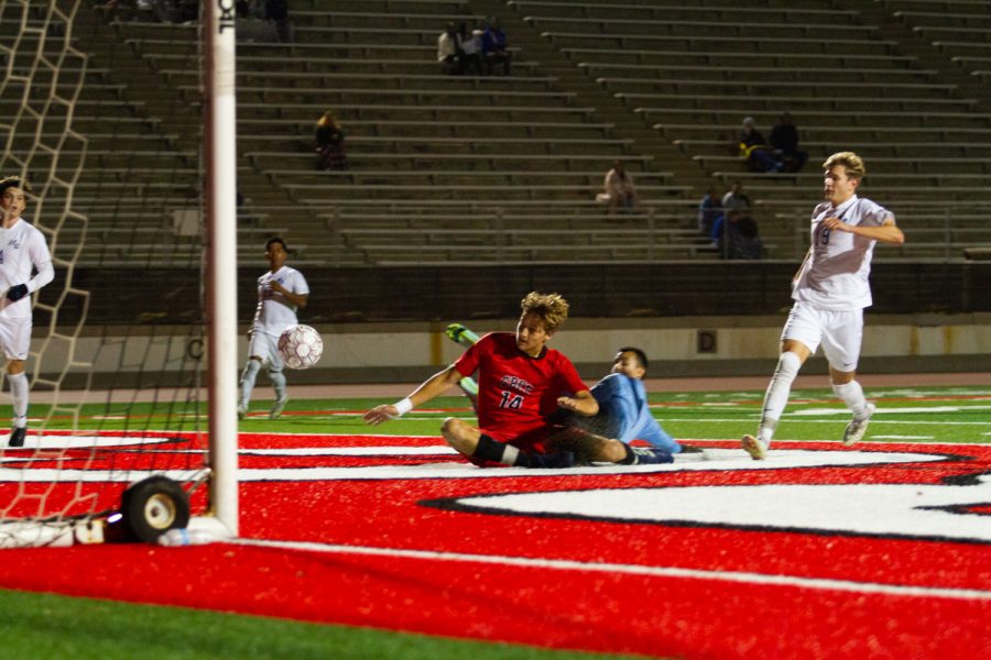 Number 14, Bart Muns, slides the ball past the goalie for City College’s second goal of the night on Oct. 19 at La Playa Stadium at City College in Santa Barbara, Calif. Their current record is (8-3-2) for the fall 2021 season.