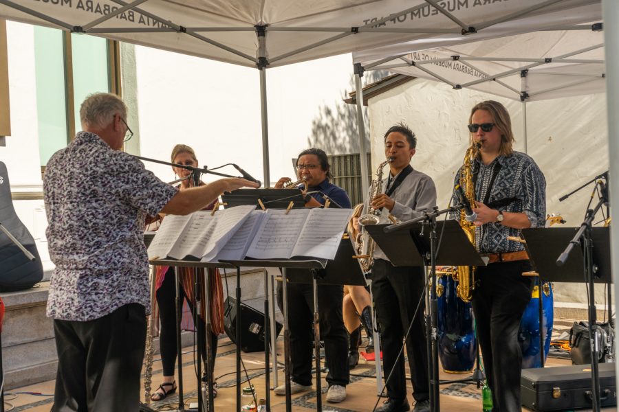 Edward Smith, City College New World Jazz Ensemble Director, conducts the band through their final composition of the day on Oct. 9 on the terrace of the Santa Barbara Museum of Art. Each student wrote their own composition based on pieces from the museum.