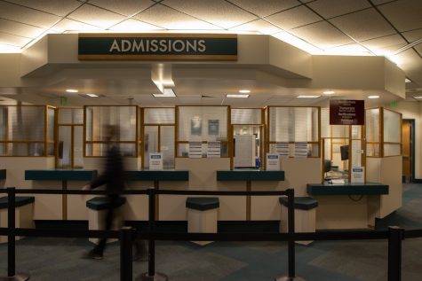 A student passes by the the Admissions counter on Nov. 2 in City College's Student Services building in Santa Barbara, Calif. The Admissions department helps with completing applications, submitting transcripts and is the place to go to when petitioning for a change in one's schedule.