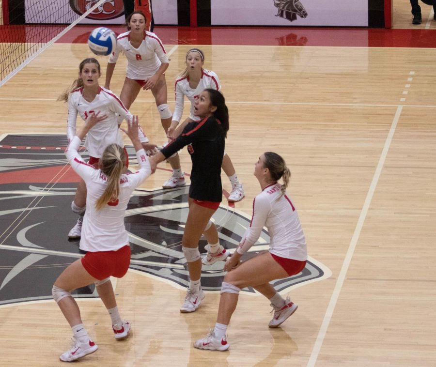 City Colleges womens volleyball team all rush to save the ball during their game against Santa Monica College on Nov. 16 at City College in Santa Barbara, Calif. Santa Barbara swept Santa Monica over all three matches. (August Lawrence)