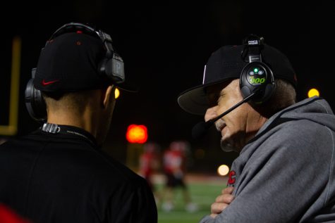 From left, wide receivers coach Rob Adan speaks with head coach Craig Moropolous during the football game against Antelope Valley on Oct. 30 at La Playa Stadium at City College in Santa Barbara, Calif. This is Adan’s seventh season coaching at City college and Moropolous’s fifteenth.