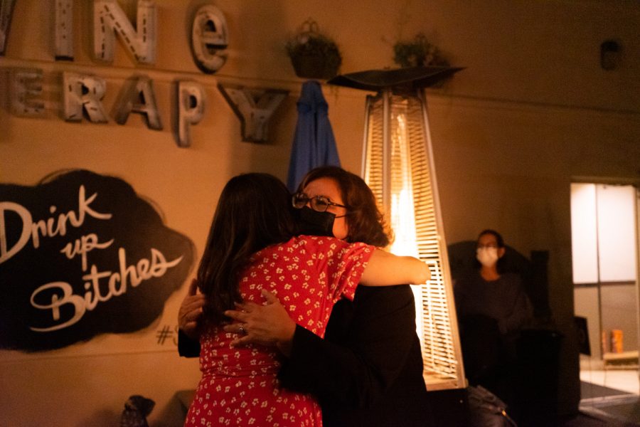 From left, Councilmember Meagan Harmon and outgoing Mayor Cathy Murillo embrace after hearing the election results on Tuesday, Nov. 2 at Unbearable in Santa Barbara, Calif. Harmon retained her seat on City Council while Murillo fell short of securing her mayoral position.