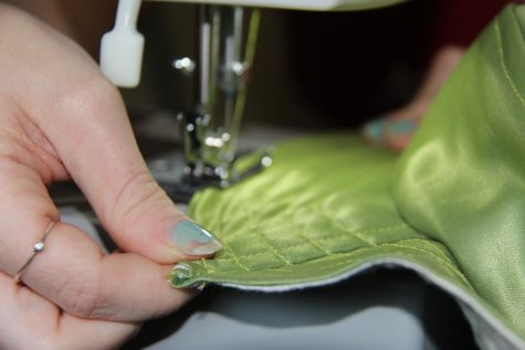 Claire Kimball sews seams onto a bucket hat on Thursday, Dec. 2 in Santa Barbara, Calif. Kimball learned how to sew from her mother and grandmother, but got back into the art during the pandemic. She was recently accepted into FIDM — the Fashion Institute of Design & Merchandising.