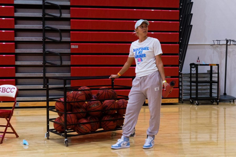 Assistant Coach Keani Albanez makes sure all the basketballs are accounted for after practice on Dec. 1 at the Sports Pavilion at City College in Santa Barbara, Calif. Albanez is the first woman to be an assistant coach for the City College men's basketball team.
