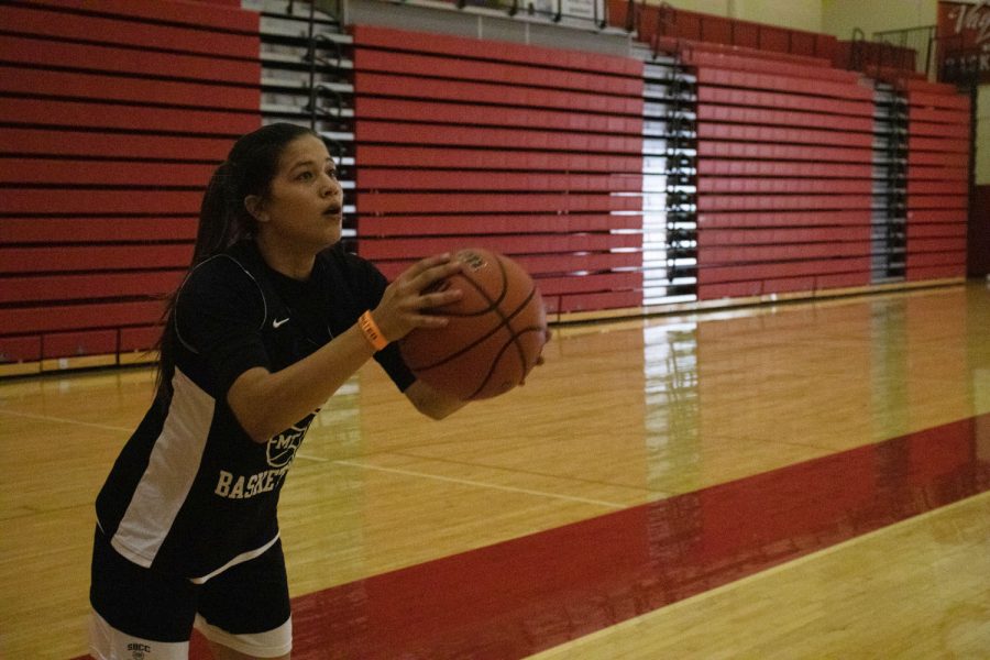 Katrina Regalado practices a three-point shot on Oct. 7 at City Colleges Sports Pavilion in Santa Barbara, Calif. At least for the first month of the spring 2022 semester, indoor games will be held with no spectators to prevent the spread of COVID-19.