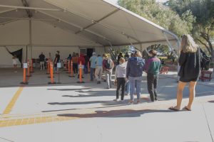 Students and staff form a line at the COVID-19 testing station on Feb. 7 at City College in Santa Barbara, Calif.