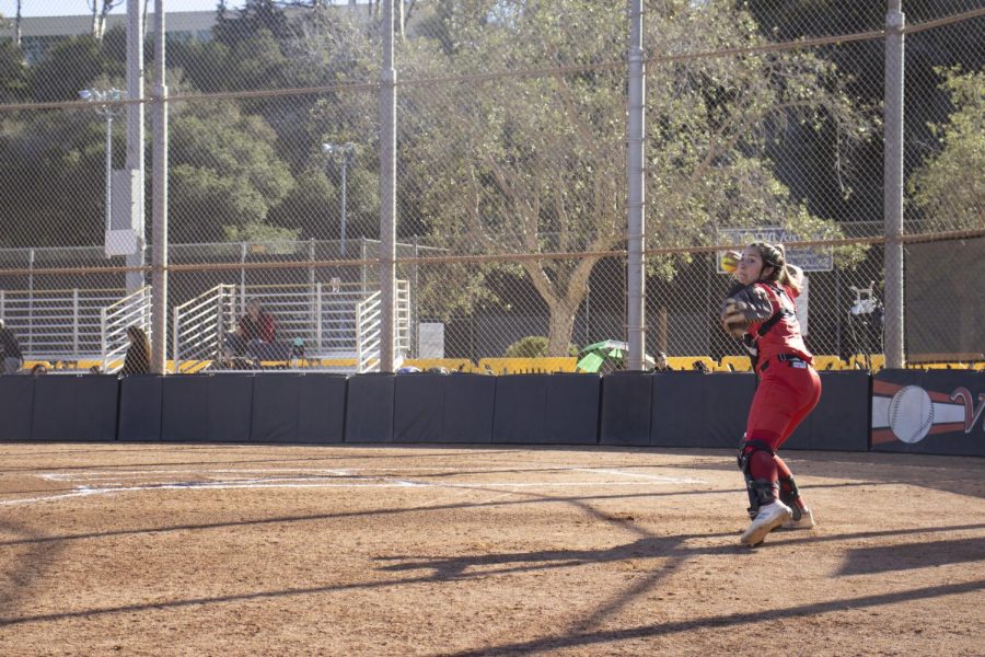 City College catcher Naveah Freitas practices catching and throwing between games against San Bernardino College on Feb. 5 at City College's baseball diamond in Santa Barbara, Calif. The San Bernardino Wolverines eliminated the City College Vaqueros two games to zero.