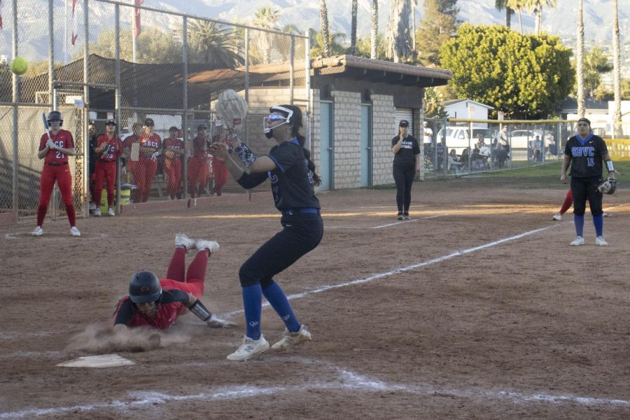 Armani Garcia dives to avoid an out while scoring a run during City College's game against San Bernardino College on Feb. 5 at City College's baseball diamond in Santa Barbara, Calif. The San Bernardino Wolverines eliminated the City College Vaqueros two games to zero.