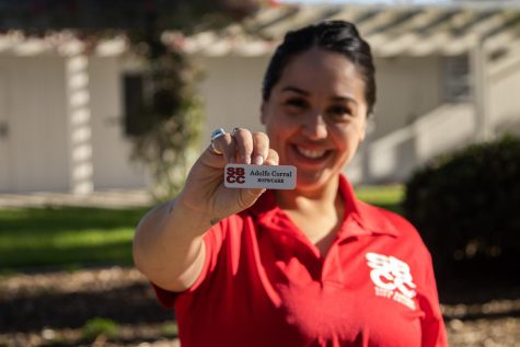 EOPS Student Program Advisor Alisha Sanchez displays the nametag of her mentor and former longtime City College employee Adolfo Corral on Wednesday, Feb. 9 at City College in Santa Barbara, Calif. Corral and his wife, Mary-Jane Beccera, died in a hit and run on Feb. 9, 2020.