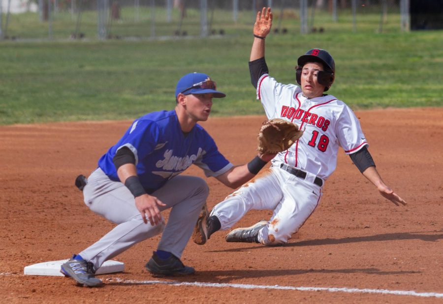 Second baseman Gavin Haimovitz, No. 18, steals third base after a wild pitch on Tuesday, March 15 at Pershing Park in Santa Barbara, Calif. Hamovitz scored first in the game for City College.