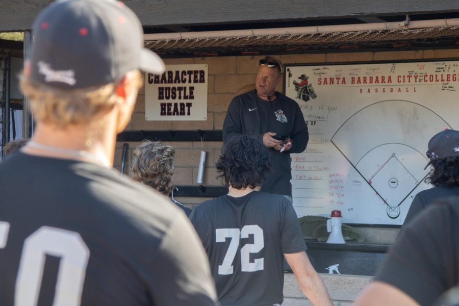 Baseball coach Jeff Walker delivers a pep talk at the end of practice on Wednesday, Feb. 16 at Pershing Park in Santa Barbara, Calif. Walker emphasized expecting drive and toughness from the team.