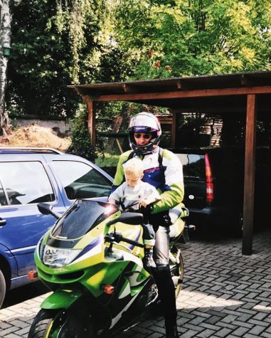 2-year-old Jan Kamillo Kreitzberg rides a motorcycle with his father Arne Kreitzberg in 2000 in Kassel, Germany.
