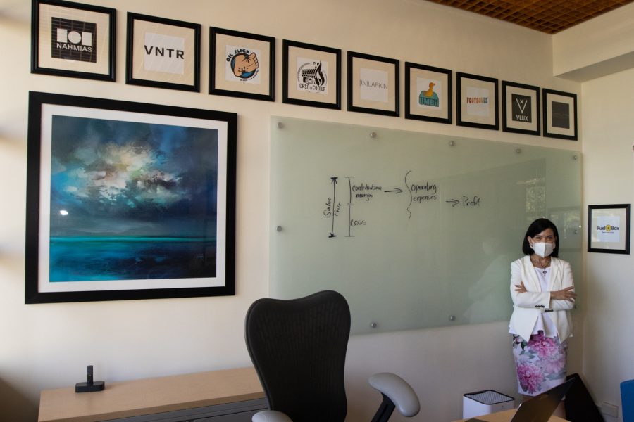 Executive Director for the Scheinfeld Center of entrepreneurship and innovation Julie Samson shows off past businesses started with the help of the program on April 6, 2022 at her City College office in Santa Barbara, Calif. Samson is always impressed and amazed with the business ideas students bring into the program.