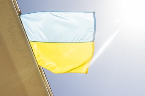 The Ukrainian flag waves in the wind as it hangs from the second story of the Physical Science building in support of Ukraine at City College on Friday, April 29 in Santa Barbara, Calif. The SBCC Foundation recently started a relief fund to aid Ukrainian students with basic needs such as housing and tuition payment.