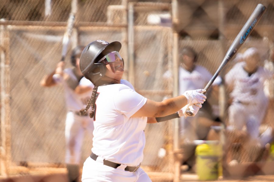Alyssa Perez, No. 13, watches as her long drive sails to the outfield on April 5, at Pershing Park in Santa Barbara, Calif. City College lost to Oxnard 12-8.