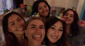 Alexia Cabral, far left, and her friends and roommate pose for a selfie before going for a night our in Santa Barbara, Calif.
