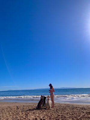 Anna Grace Butler feeds her black lab, Shadow, and his friends in Santa Barbara, Calif.