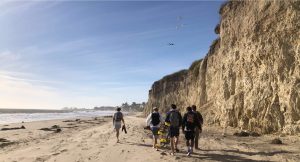 A photo taken by Dylan Lyke of their boyfriend and his roommates walking along Campus Point in Santa Barbara, Calif.