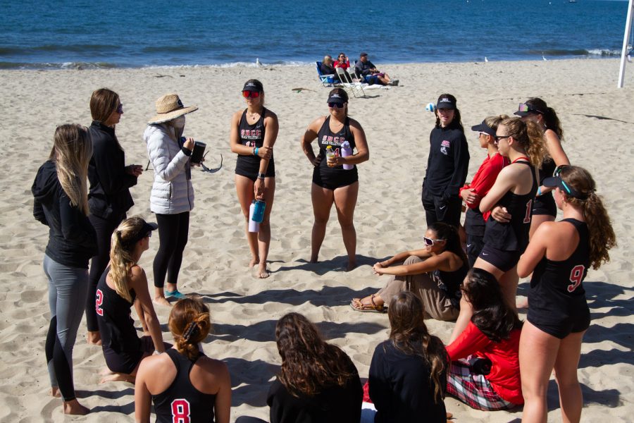 The City College beach volleyball team discusses their 5-0 win against Moorpark College with head coach Ariana Garner on Friday, April 15 at East Beach in Santa Barbara, Calif. The Vaqueros swept Moorpark College 5-0 in a Western State Conference match.