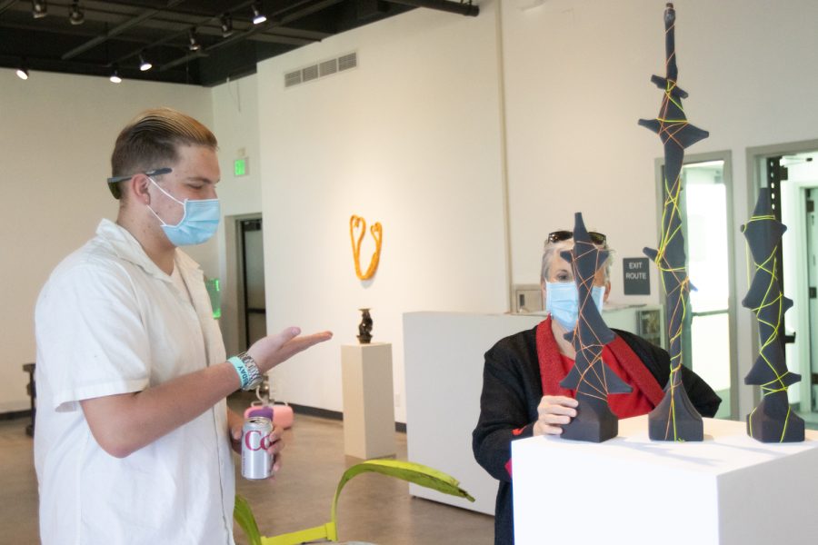 City College student Tilman Stoppler showcases his sculpture, "Color string and skin," on April 5 at the "Structure and Skin II" Atkinson Gallery pop-up exhibition at City College in Santa Barbara, Calif. This piece was made of wood, metal rods, string and stockings. 