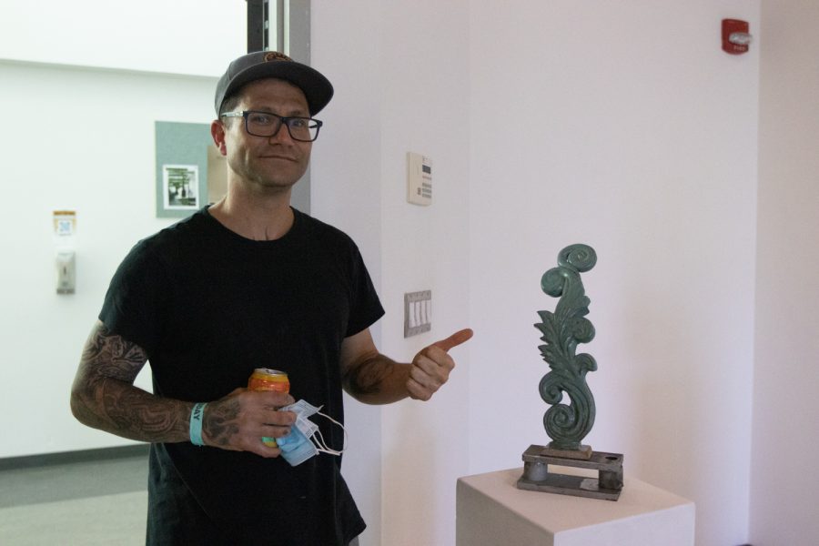 Art student Brenno Ressa showcases his piece "Flor Dura" on April 5 at the "Structure and Skin II" Atkinson Gallery pop-up exhibition at City College in Santa Barbara, Calif. This piece is made of glazed ceramic clay.