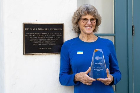 Sally Saenger, recipient of the 2022 Dean Murakami Advocate of the Year Award, stands in front of the James Tannahill Auditorium on Monday, April 4 at City Colleges Schott Campus in Santa Barbara, Calif. Saenger said she first taught at the auditorium in 1982.