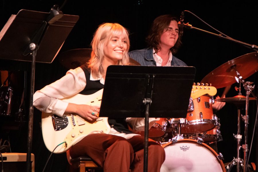 Guitarist Ella Parent smiles as drummer Ethan Fossum plays an extended solo during a jazz show on Monday, April 11 at SOhO Restaurant and Music Club in Santa Barbara, Calif. Fossum changed tempos throughout his solo, which kept his fellow members guessing about his next move.