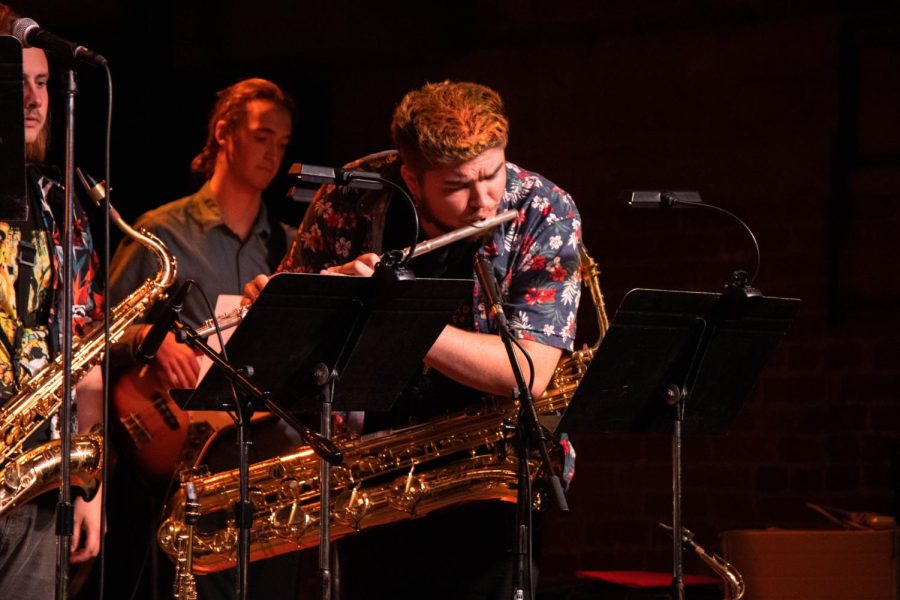 Owen Richards takes a break from the baritone sax to deliver a quick flute solo on Monday, April 11 at SOhO Restaurant and Music Club in Santa Barbara, Calif. Richards was one of the three brass players part of the New World Jazz Ensemble.