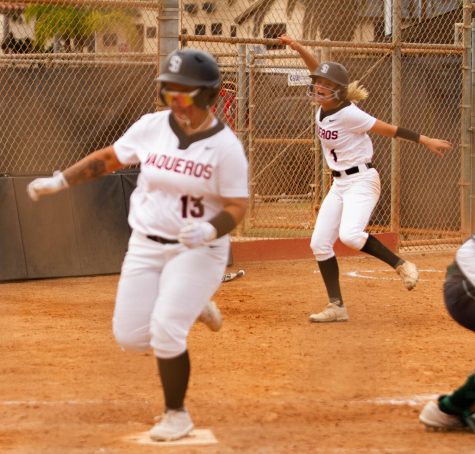 Natalie Depasquale, No. 1, cheers on Alyssa Perez, No. 13 as she scores the winning run against Cuesta College on Thursday, March 31 at Pershing Park in Santa Barbara, Calif. The Vaqueros took home a win, ending the game at 9-8.