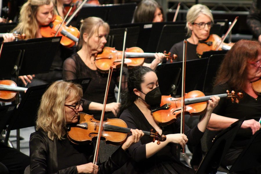 The violin section plays during the first-ever live performance of "A Day in the Life" by symphony member Scott Lillard on Sunday, April 24 at City College’s Garvin Theatre in Santa Barbara, Calif. (<a href="https://www.thechannels.org/staff_profile/yarrow-hogan/">Yarrow Hogan</a>)