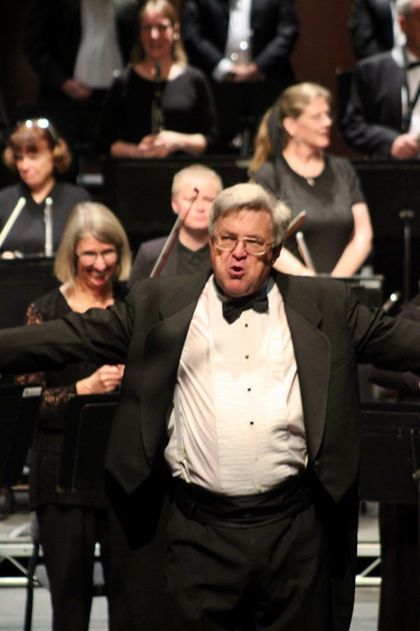 Symphony conductor James Mooy expresses his excitement after a City College community symphony orchestra production on Sunday, April 24 at City College’s Garvin Theater in Santa Barbara, Calif. Shaking the hands of musicians and joyously hearing the audience applause, Mooy faced the audience and bowed at the end of the show.