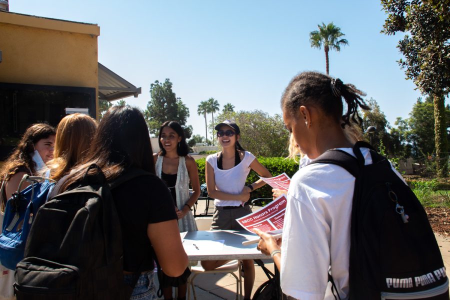 From left, Co-presidents of the Honors Program, Divya Lih Ramesh and Sarah Do, tell SBCC students the requirements to join on Wednesday, Sept. 7 at City College in Santa Barbara, Calif. They also mentioned a whale watching trip that the program is planning.