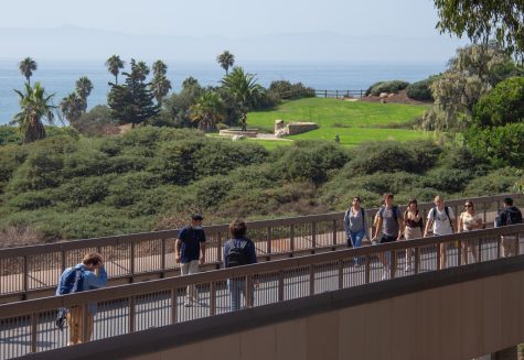 Students cross the bridge between East and West campus to get to class on Wednesday, Sept. 11 at City College in Santa Barbara, Calif. The bridge makes it easier for students to get from one side of campus to the other instead of having to cross the street below.