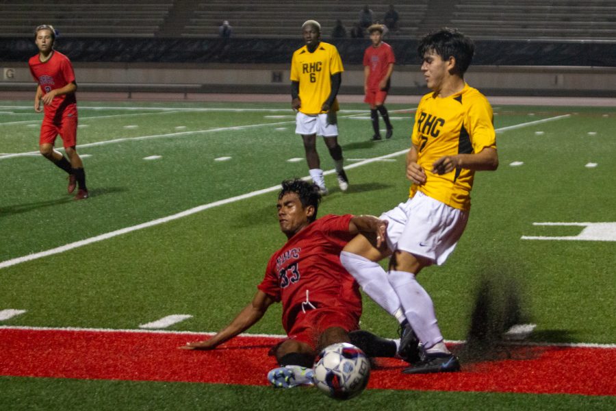 Forward No. 33, Brandon Garcia De La Fuente, slide tackles Rio Hondo Defender No. 7, Cesar Naranjo. The players were going head to head all night on Friday, Sept. 16 at La Playa stadium in Santa Barbara, Calif.
