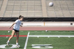 Defensive midfielder Sarah Hardin (#5) heads a ball towards a teammate during women's soccer practice October 19 at La Playa Stadium in Santa Barbara, California.
