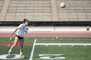 Defensive Midfielder Sarah Hardin (No. 5) headers a ball towards a teammate during a women’s soccer practice on Oct. 19 at La Playa Stadium in Santa Barbara, Calif. The drills Hardin ran placed an emphasis on long, accurate passing and ball control.