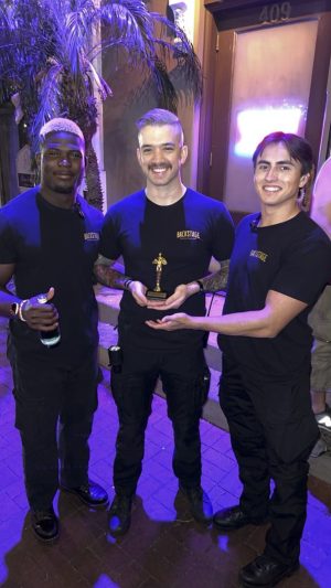 Security Guard Joseph Olsson photographed at his work with Backstage Bar coworkers Mitch Cunningham (center) and Sandro Cate (right) in Santa Barbara, Calif. Photo provided courtesy of Olsson.