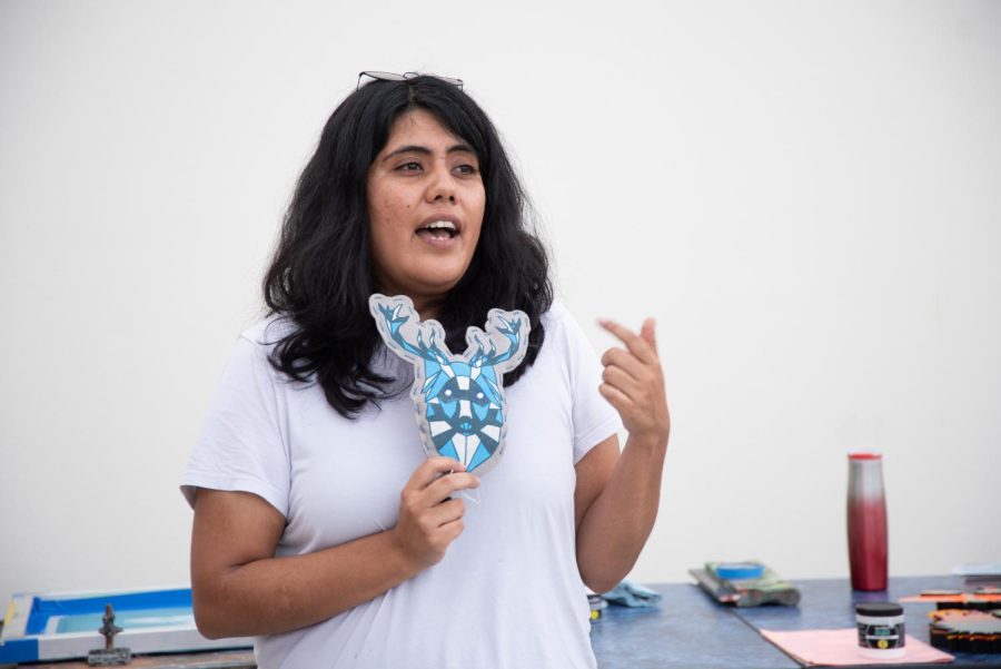 Artist Evelyn Contreras displays a recently created stitched print at her artist demonstration on Oct. 19 at the Atkinson Gallery in Santa Barbara, Calif. A focal point of Contreras’ talk was her use of a variety of different printing mediums to enhance her artwork.