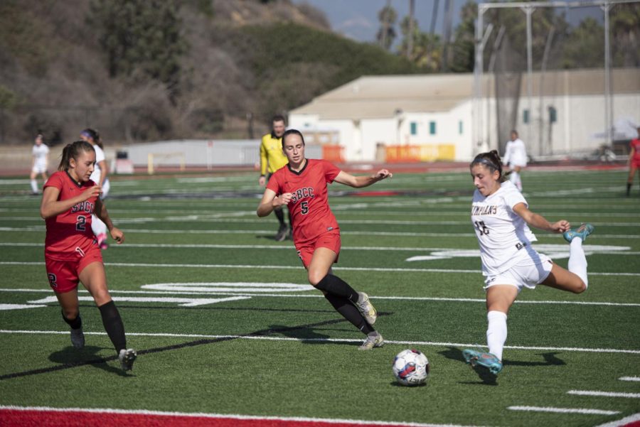 Defenders Sarah Hardin (No. 5) and Ana Magdalena Puentes (No. 2) guard the goal against forward Audrey Reed (No. 12) on Oct. 21 at La Playa Stadium in Santa Barbara, Calif. Hardin and Puentes worked together as a defense throughout the game to put pressure on the Olympians attackers.