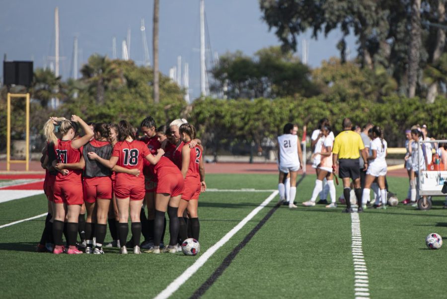 The Vaqueros huddle on the field during halftime on Oct. 21 at La Playa Stadium in Santa Barbara, Calif. After ending the half 0-0, both teams regrouped and discussed strategies to pull forward in the game.