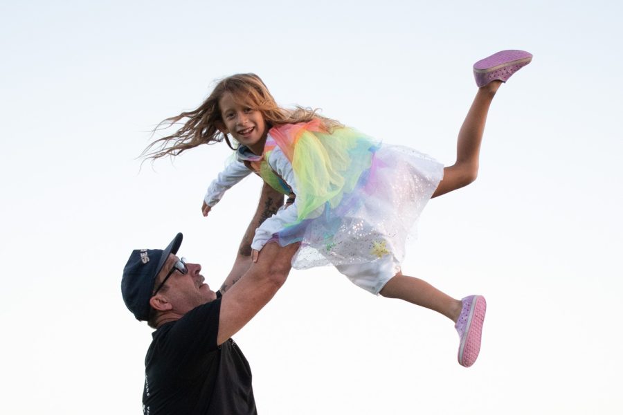 Chris Puglisi lifts his daughter Kinley Puglisi into the air on Oct. 27 at City College’s Great Meadow in Santa Barbara, Calif. Kinley repeatedly sprinted down from atop the sea overlook hill to be caught and swung into the air by her father’s arms.