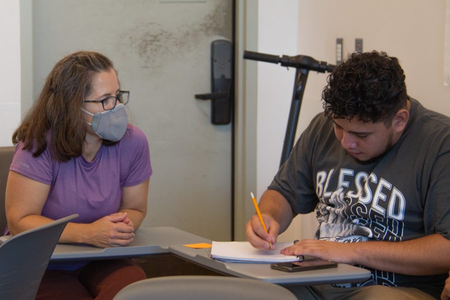Laboratory Teacher’s Assistant Jennifer Rawling helps out student Rudy Alcala Velazquez on Oct. 17 at the Humanities building in Santa Barbara, Calif. Alcala Velazquez is in the advanced ESL class.